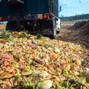 A truck dumps food waste at the Cornell Composting Facility.